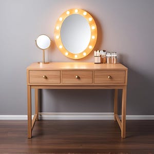 May include: A wooden vanity table with three drawers and a round mirror with light bulbs around the frame. There is a smaller round mirror on the table and a row of makeup bottles.