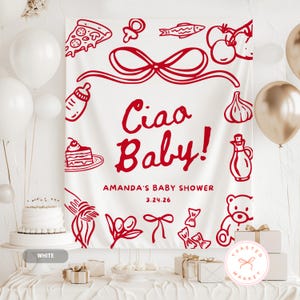 May include: A white fabric backdrop with red illustrations of food items and the text "Ciao Baby!" in a script font. The backdrop is for Amanda's baby shower on 3.24.26. White and gold balloons are in the background.