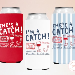 May include: Three can coolers with the text "She's a Catch!" and "I'm a Catch!" in white and navy blue. Each cooler features a fish, wine glass, and hook graphic. The text "Newport 2025" and "Dainelle's Bachelorette" are also included.