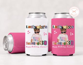 May include: Two foam can coolers, one white and one pink, featuring a graphic of a child wearing sunglasses and a floral shirt. The text reads Look Who's turning 30 Happy Birthday, Lauren! with colorful star accents and a collage-style font.