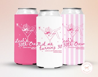 May include: Three can coolers in pink and white, each with a unique design. The designs feature a woman in a martini glass, with text that reads "Leah's 30th Crew" and "Not me turning 30". Perfect for a birthday celebration.