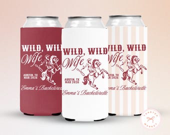May include: Three can coolers with the text "WILD, WILD Wife" and a graphic of a person riding a horse. The coolers are in burgundy, white, and a striped pattern. The text "Austin, TX MAR 2026" and "Emma's Bachelorette" are also printed.