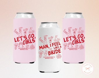 May include: Three can coolers with text and graphics for a bachelorette party. Two pink coolers say "Let's Go, Girls" with illustrations. The center white cooler says "Man, I Feel Like a Bride". All have "Kate's Bachelorette Nashville 2025".