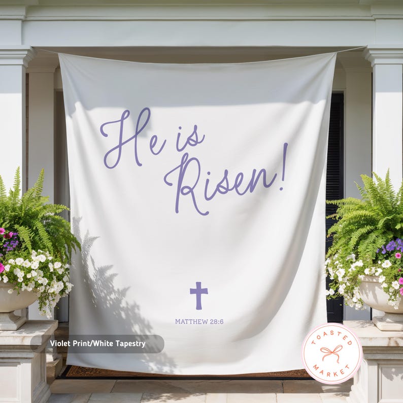 May include: White tapestry with violet text that reads "He is Risen!" and a cross, with "Matthew 28:6" below. The tapestry is hanging on a porch, flanked by potted plants.