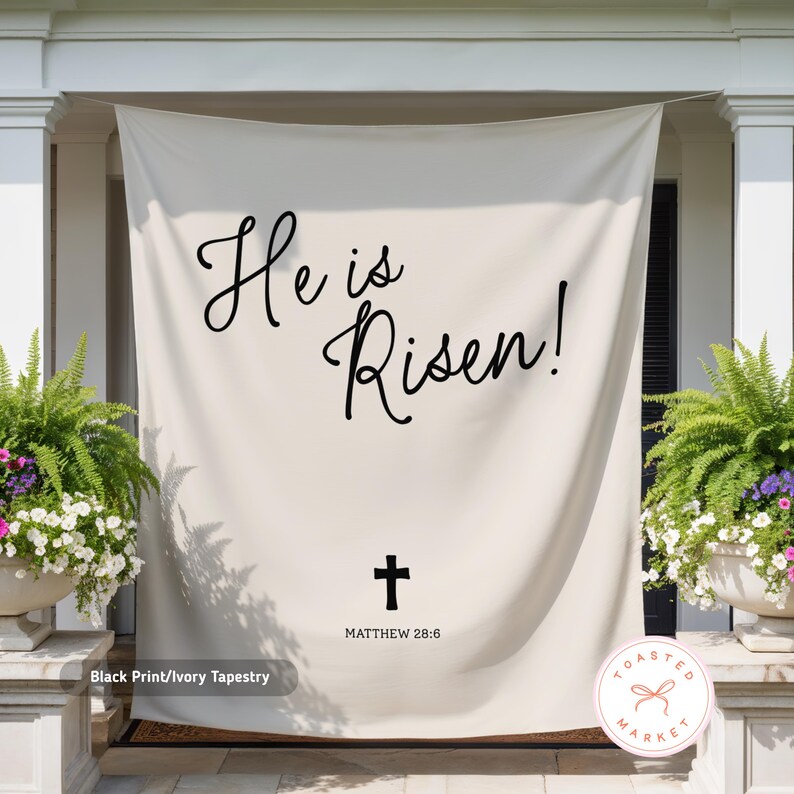 May include: Ivory tapestry with black script reading "He is Risen!" and a cross, with "MATTHEW 28:6" below. The tapestry is hanging on a porch, flanked by potted plants. The words "Black Print/Ivory Tapestry" are at the bottom.
