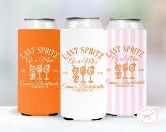 May include: Three foam can coolers featuring the text LAST SPRITZ As a Miss, July 2026, and Emma's Bachelorette CHARLESTON, SC. The designs include three cocktail glasses. One cooler is solid orange, one is solid white, and one has pink stripes.