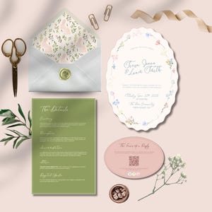 Può includere: Un assortimento di partecipazioni di nozze, tra cui un invito floreale, una scheda dettagli e una scheda di risposta. L'invito mostra i nomi "Trevor Jones & Luna Faith". Una busta bianca con un motivo a coniglietto è sigillata con un sigillo di cera dorata.