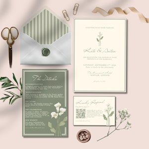 May include: A wedding invitation suite with a cream and sage green color scheme. The set includes an invitation, details card, RSVP card, and envelope, along with decorative elements like scissors and paperclips. The invitation features the names "Kate & Anton".