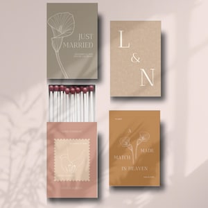 Può includere: Quattro scatole di fiammiferi con disegni a tema matrimonio. Una scatola recita "Just Married" con un'illustrazione floreale. Un'altra presenta le lettere "L & N". La terza scatola dice "A Match Made in Heaven".