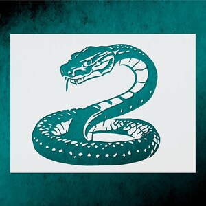 May include: A teal-colored snake illustration on a white background. The snake is coiled, with its head raised and tongue extended. The design features a detailed pattern of scales and markings, creating a striking visual.