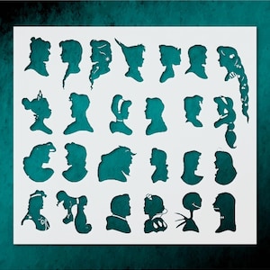 May include: A white stencil featuring teal silhouettes of various characters. The stencil includes profiles of princesses, Peter Pan, and other recognizable figures. The cut-out designs are arranged in rows and columns on a white background.