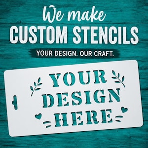 May include: White custom stencil with the text "YOUR DESIGN HERE" cut out. The stencil has decorative leaf and heart cutouts. The background features the text "We make CUSTOM STENCILS" and "YOUR DESIGN. OUR CRAFT."