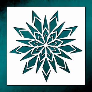 May include: A square stencil featuring a teal, symmetrical, multi-pointed star or snowflake design. The pattern consists of layered, sharp-edged geometric shapes radiating from a central point, creating a complex, repeating starburst motif.