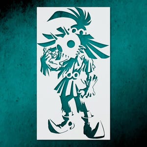 May include: A white stencil featuring a stylized character with a mask and elaborate headwear. The character is depicted in a dynamic pose, with intricate cut-out details. The background is a teal color.