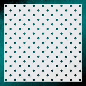 May include: A white square stencil with a repeating pattern of evenly spaced, dark teal circles. The stencil is set against a teal and dark green background, creating a contrast that highlights the circular design.