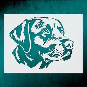 May include: A teal and white stencil of a Labrador Retriever dog's head, facing right. The dog's features are detailed, with visible eyes, nose, and ear. The stencil is on a white background, with a teal border.