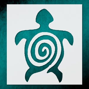 May include: A white stencil of a turtle with a spiral design on a teal background. The turtle shape is cut out, revealing the teal color beneath. The design is simple and graphic, suitable for various craft projects.