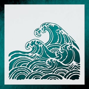 May include: A stencil featuring a stylized ocean wave design. The design is cut out of white material, revealing a teal background. The wave crests are detailed with white lines, creating a contrast against the teal.