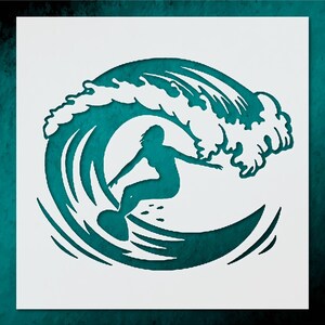 May include: A teal and white stencil design featuring a surfer riding a large wave. The surfer is a silhouette, and the wave is detailed with foamy crests. The design is set against a teal background.