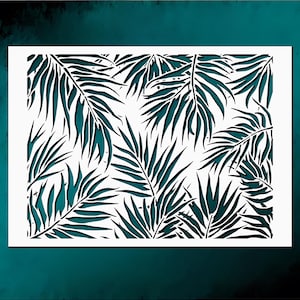 May include: White stencil featuring a tropical palm leaf design. The leaves are a dark teal color, creating a contrast against the white background. The stencil is rectangular and suitable for various craft projects.