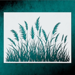 May include: A teal paper cut-out of tall grass and reeds against a white background. The grass blades and seed heads are detailed, creating a naturalistic silhouette. The artwork is set against a dark teal backdrop.