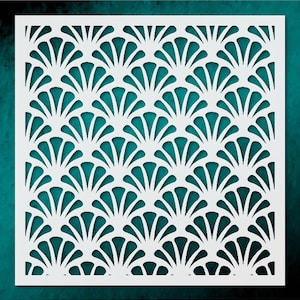 May include: A white, square stencil featuring a repeating Art Deco fan pattern. The design is cut out, revealing a teal background. The stencil is likely used for crafts, painting, or decorative purposes, offering a stylish, geometric design.