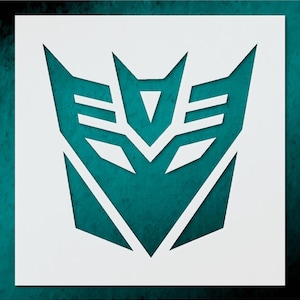 May include: White stencil of the Decepticon logo, a stylized emblem with sharp angles and a central triangle. The design is set against a teal background, creating a bold contrast. The logo is a symbol from the Transformers franchise.
