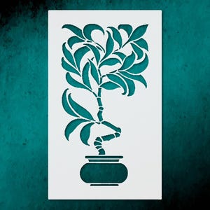May include: A stencil featuring a stylized plant design. The plant has long, curved leaves and a curved stem, all in a teal color. The plant is potted in a teal pot. The stencil is on a white background.