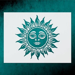 May include: A teal sun design with a smiling face and radiating rays, set against a white background. The sun's features include closed eyes and a curved mouth. The design is on a white rectangular surface, with a teal background.