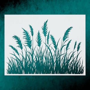 May include: A teal-colored paper cut-out of tall grass and reeds against a white background. The design features detailed silhouettes of various grass blades and seed heads, creating a natural, botanical theme. The artwork is set against a teal textured backdrop.