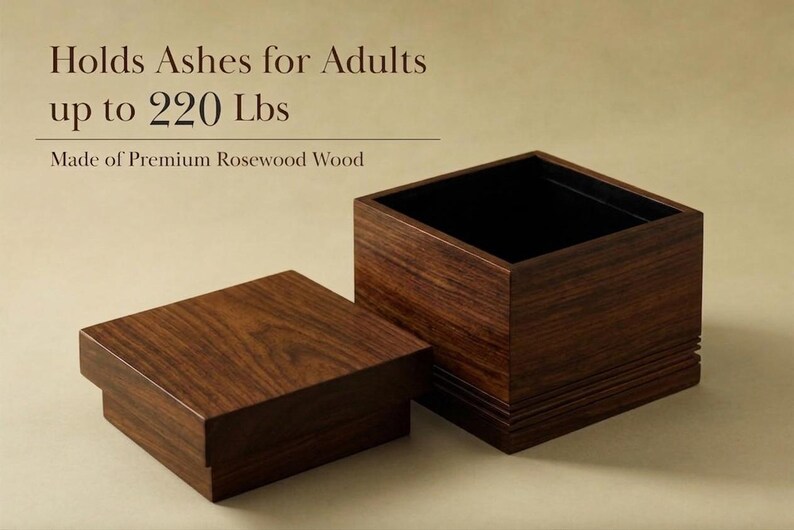 May include: A dark brown, rectangular wooden urn with a lid, made of premium rosewood. The open urn has a black interior. Text on the image reads: "Holds Ashes for Adults up to 220 lbs."