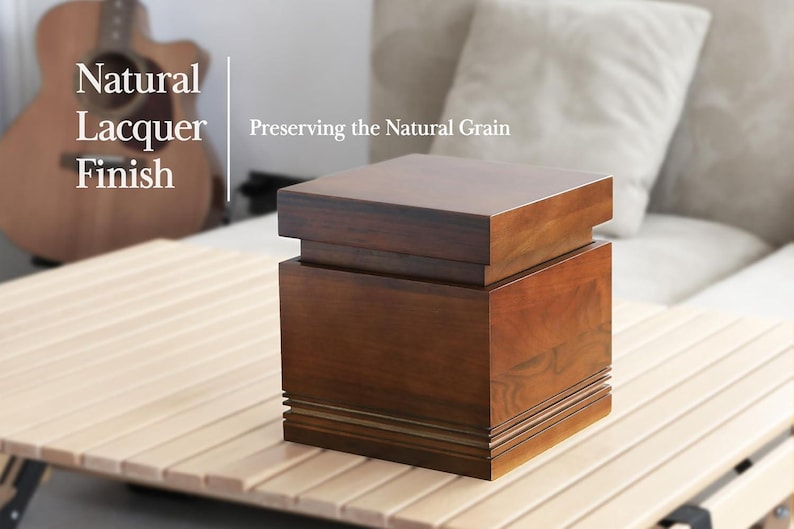 May include: A wooden box with a natural lacquer finish, showcasing the natural grain. The box is a warm brown color and sits on a light-colored wooden surface. Text on the image reads "Natural Lacquer Finish" and "Preserving the Natural Grain."