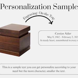 May include: A wooden box with a dark brown finish, featuring a layered design. The text "Personalization Sample" is at the top. The text "Engraving On the Top" is above the box. The box has a sample inscription with a name and dates.