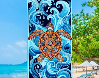 May include: A rectangular beach towel featuring a detailed orange and red sea turtle design. The turtle is centered against a backdrop of stylized blue ocean waves. The towel has a light blue border and is hanging on a clothesline.