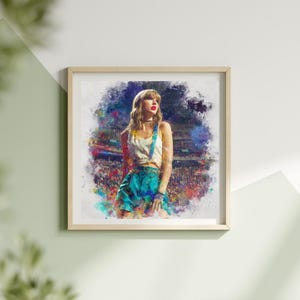 May include: A framed watercolor print featuring a woman in a white top and teal shorts with suspenders. The artwork has a colorful, abstract background and is set in a light wood frame. The subject is looking to the side.