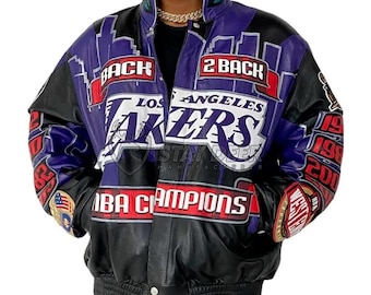 May include: A black, purple, and white Los Angeles Lakers NBA Champions jacket. The jacket features the team's name and logo, along with the words "2 Back" and "NBA Champions". The jacket has a ribbed collar and cuffs.