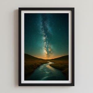 May include: Framed art print featuring a vibrant night sky with the Milky Way over a river winding through a landscape. The artwork showcases a dark teal sky filled with stars, a golden horizon, and a flowing river.