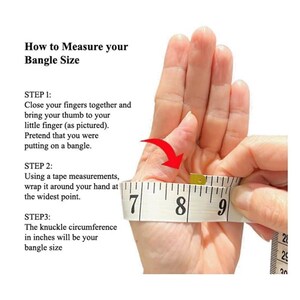 May include: Image showing how to measure your bangle size. A hand is shown with fingers closed, thumb to little finger. A measuring tape is wrapped around the hand at the widest point. Text explains the steps to measure the knuckle circumference in inches.