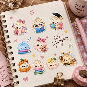 May include: A spiral-bound notebook featuring various stickers of cartoon dumplings in different activities, including reading, sleeping, and wearing a graduation cap. The text Cute Dumpling is printed in the center, surrounded by small hearts and stars.