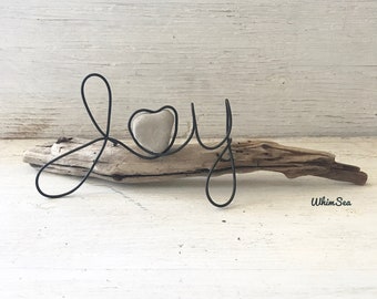 Wire word “Joy” with heart rock on driftwood beach lover decor sculpture