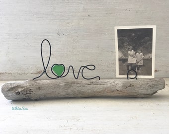 Green sea glass in Love wire word picture holder on driftwood