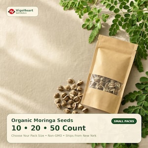 May include: A package of organic moringa seeds with a clear window, alongside loose seeds. The packaging is brown with the text "Organic Moringa Seeds 10 • 20 • 50 Count". Green leaves are in the background. The brand logo "VigoHeart NATURALS" is in the top left corner.
