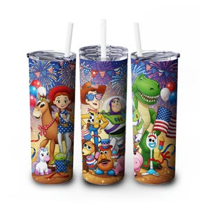 May include: Three stainless steel tumblers with white straws, featuring a colorful design of Toy Story characters celebrating Independence Day. The design includes fireworks, flags, and balloons, with a brown and yellow background.