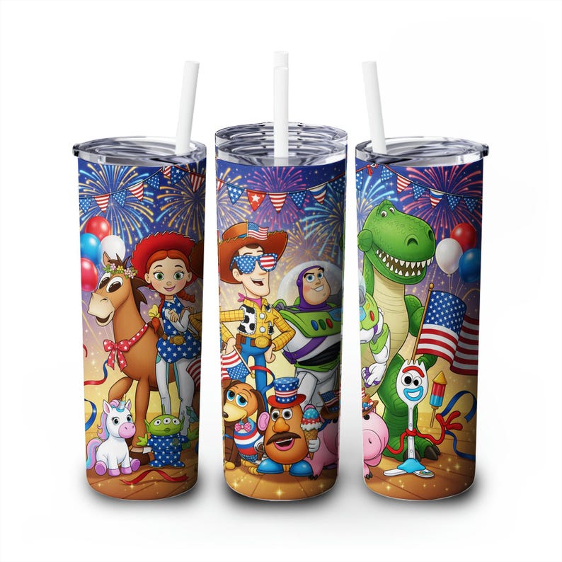 May include: Three stainless steel tumblers with white straws, featuring a colorful design of Toy Story characters celebrating Independence Day. The design includes fireworks, flags, and balloons, with a brown and yellow background.