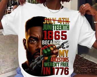 May include: A white t-shirt featuring a graphic of a Black person's face and a fist holding a broken chain. The text reads: JULY 4TH JUNETEENTH 1865 BECAUSE MY ANCESTORS WERENT FREE IN 1776. The design uses red, black, green, and yellow color accents.