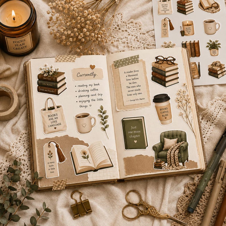 May include: An open journal featuring various stickers including stacks of books, a coffee cup, a green armchair, and a quote by George R.R. Martin. The pages contain handwritten text and decorative elements like a tote bag and a bookmark.