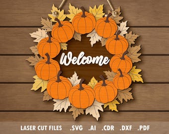 May include: A wooden fall-themed wreath with orange pumpkins and autumn leaves. The word "Welcome" is in the center. The wreath is hanging on a wooden background. The bottom of the image has the text: LASER CUT FILES .SVG .AI .CDR .DXF .PDF.