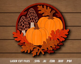 May include: Wooden fall-themed artwork featuring two orange pumpkins, two brown morel mushrooms, and autumn leaves in shades of orange and red. The design is set within a dark red circular frame, with the text "LASER CUT FILES" at the bottom.