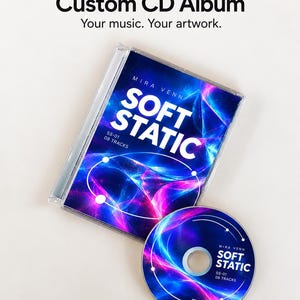 May include: A custom CD album in a clear plastic jewel case with a matching disc. The cover art features a vibrant blue and magenta abstract light pattern with the text MIRA VENN, SOFT STATIC, SS-01, and 08 TRACKS printed in white.