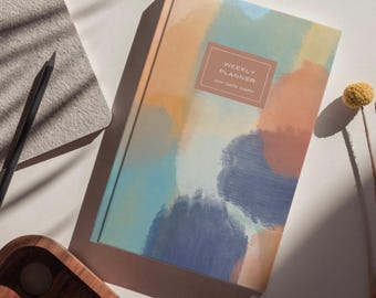 A5 Weekly Planner with to do lists, monthly goals and budget planner.